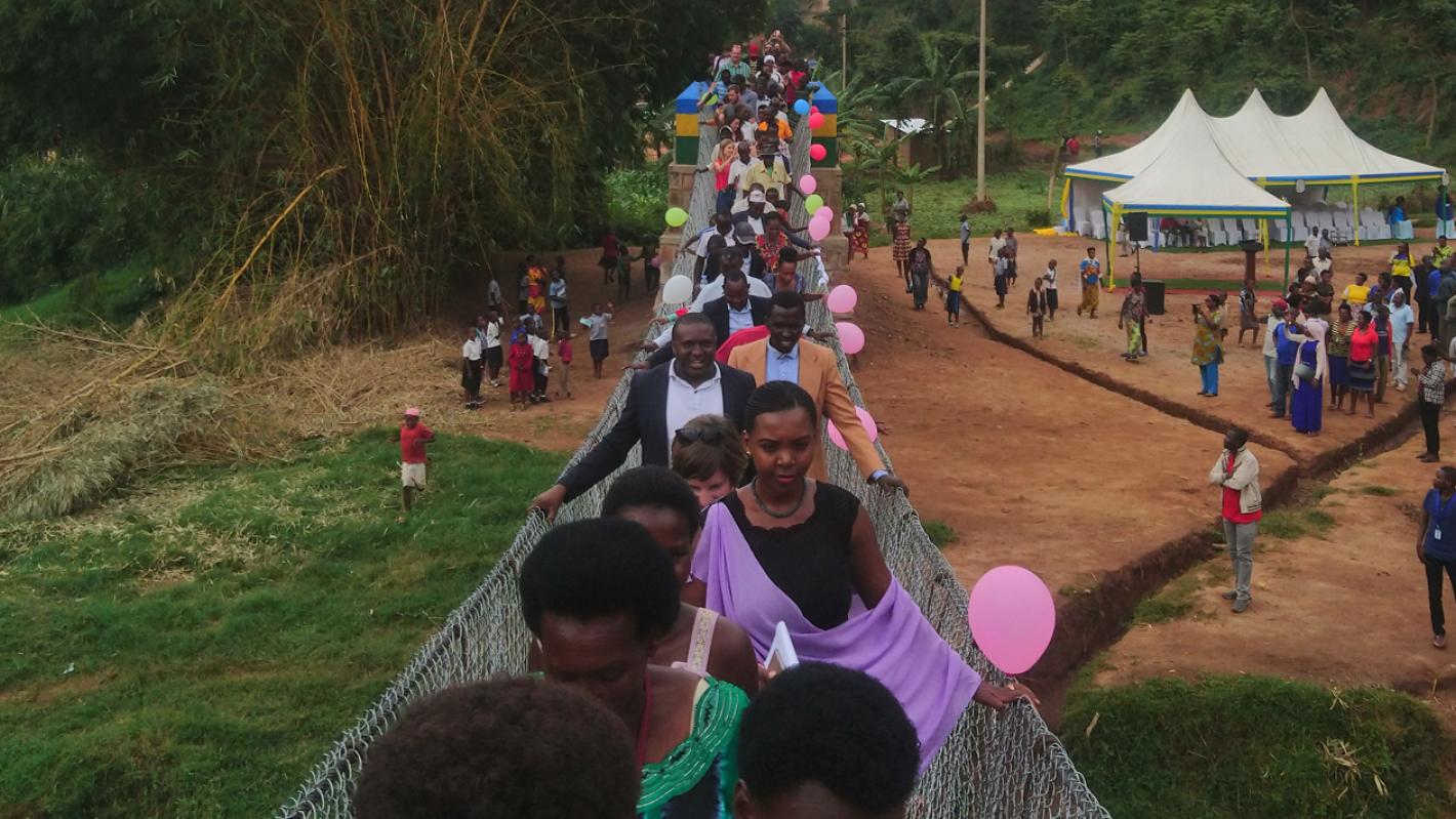 Locals crossing Gatare Bridge Hero Image