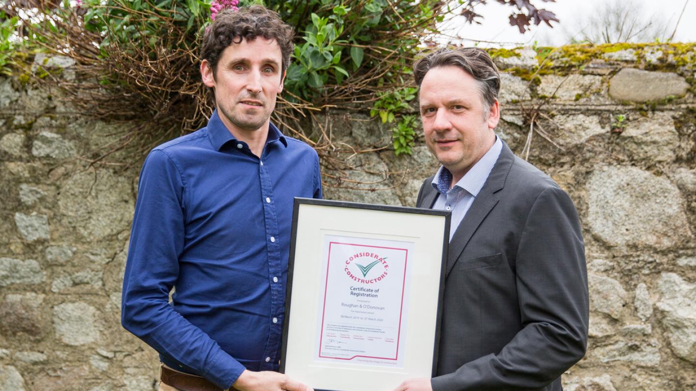 ROD's Edward Warren and Marc Jones with the company's certificate of registration with the Considerate Constructors Scheme